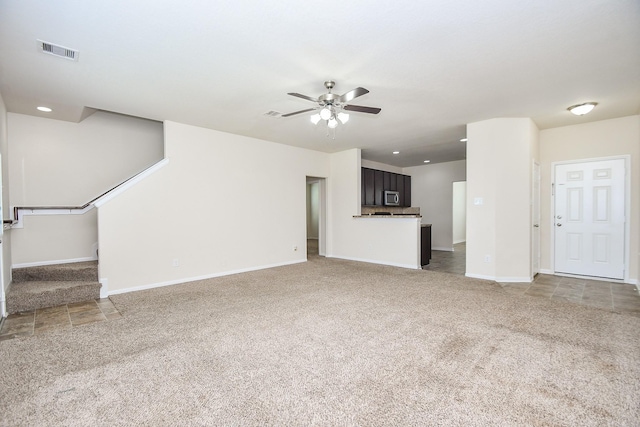 15315 Signal Ridge Way, Cypress, TX 77429 - unfurnished living room featuring light carpet, ceiling fan, and recessed lighting