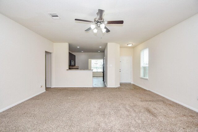 15315 Signal Ridge Way, Cypress, TX 77429 - unfurnished living room with a ceiling fan, carpet flooring, and recessed lighting