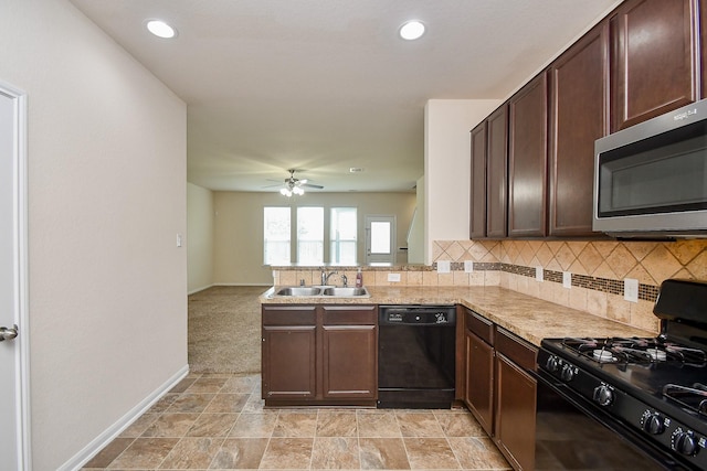 15315 Signal Ridge Way, Cypress, TX 77429 - kitchen featuring black appliances, decorative backsplash, light countertops, dark brown cabinets, and a ceiling fan