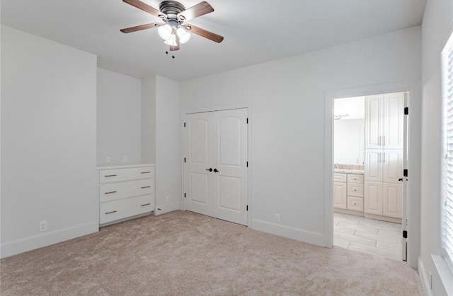 5708 Dolores St Unit A, Houston, TX 77057 - unfurnished bedroom with light colored carpet, connected bathroom, and ceiling fan
