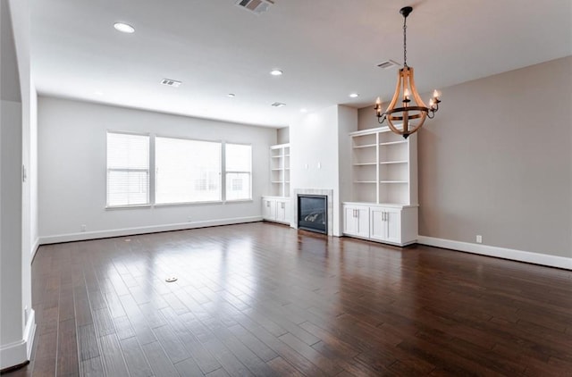 5708 Dolores St Unit A, Houston, TX 77057 - unfurnished living room featuring a chandelier, dark wood finished floors, recessed lighting, and a glass covered fireplace