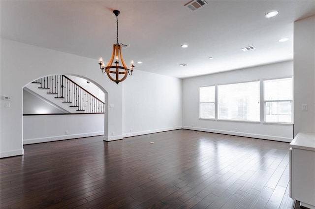 5708 Dolores St Unit A, Houston, TX 77057 - unfurnished living room featuring arched walkways, dark wood-type flooring, recessed lighting, a chandelier, and stairs