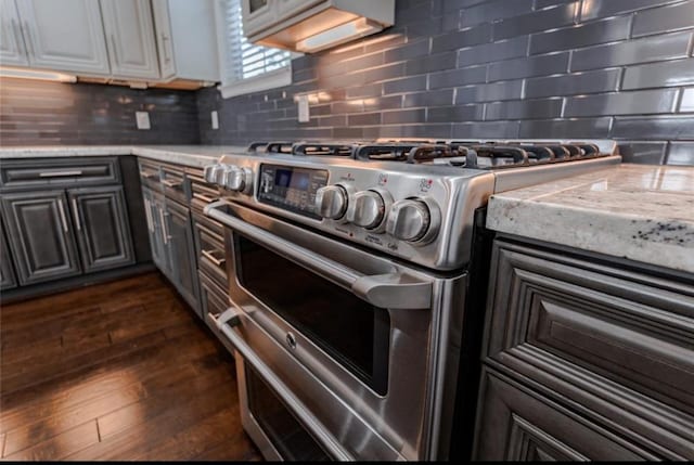 5708 Dolores St Unit A, Houston, TX 77057 - kitchen with double oven range, light countertops, tasteful backsplash, and dark wood-style floors