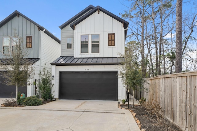 5361 Creekmont Oaks Ln, Houston, TX 77091 - modern inspired farmhouse featuring board and batten siding, a standing seam roof, an attached garage, and driveway