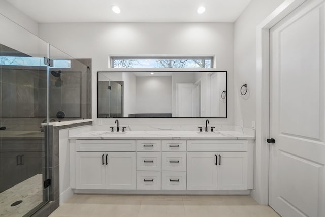 5361 Creekmont Oaks Ln, Houston, TX 77091 - bathroom with double vanity, a shower stall, tile patterned flooring, and recessed lighting