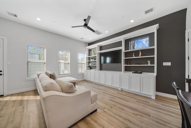 5361 Creekmont Oaks Ln, Houston, TX 77091 - living area featuring healthy amount of natural light, light wood-style flooring, ceiling fan, and recessed lighting