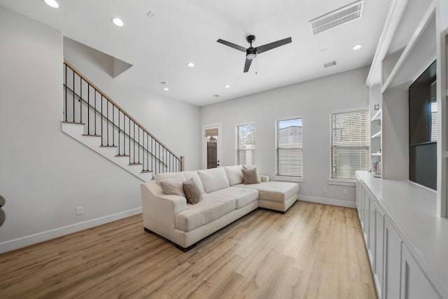 5361 Creekmont Oaks Ln, Houston, TX 77091 - living room with a ceiling fan, light wood-style floors, recessed lighting, and stairs