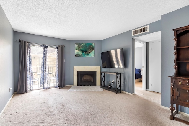 12550 Whittington Dr Unit 814, Houston, TX 77077 - living room with carpet floors, a high end fireplace, and a textured ceiling