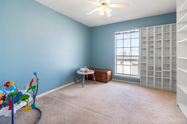 12550 Whittington Dr Unit 814, Houston, TX 77077 - miscellaneous room featuring healthy amount of natural light, carpet floors, ceiling fan, and a textured ceiling