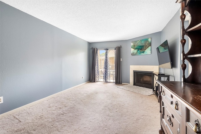 12550 Whittington Dr Unit 814, Houston, TX 77077 - unfurnished living room with a fireplace, carpet floors, and a textured ceiling