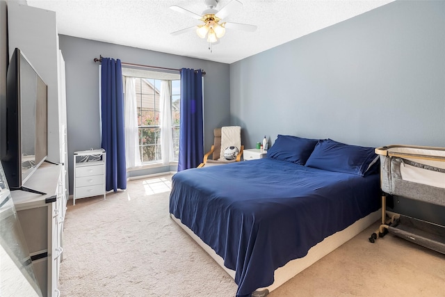 12550 Whittington Dr Unit 814, Houston, TX 77077 - bedroom with light carpet, a textured ceiling, and a ceiling fan