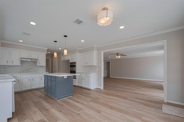 7419 Foxton Place Ct, Houston, TX 77095 - kitchen with ceiling fan, white cabinetry, double oven, recessed lighting, and light countertops