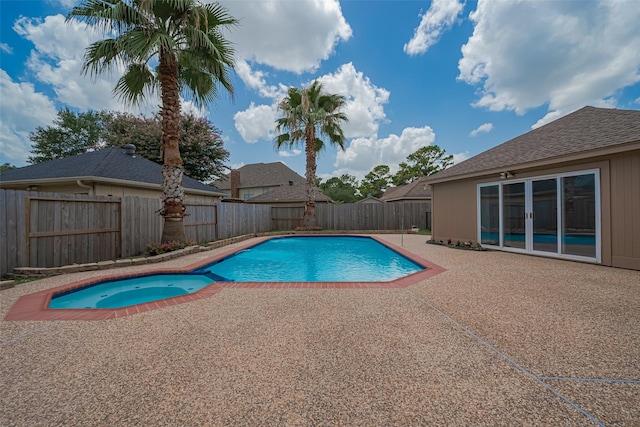 7419 Foxton Place Ct, Houston, TX 77095 - view of swimming pool featuring a patio area, a pool with connected hot tub, and a fenced backyard