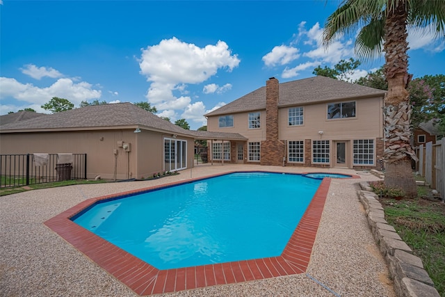 7419 Foxton Place Ct, Houston, TX 77095 - view of swimming pool with a pool with connected hot tub and a patio