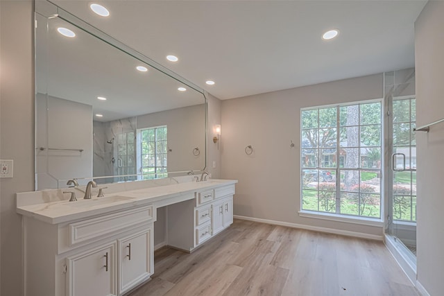 7419 Foxton Place Ct, Houston, TX 77095 - full bathroom featuring double vanity, a shower stall, recessed lighting, and wood finished floors
