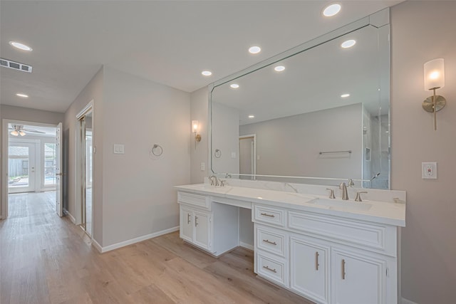 7419 Foxton Place Ct, Houston, TX 77095 - bathroom featuring wood finished floors, double vanity, recessed lighting, and ceiling fan