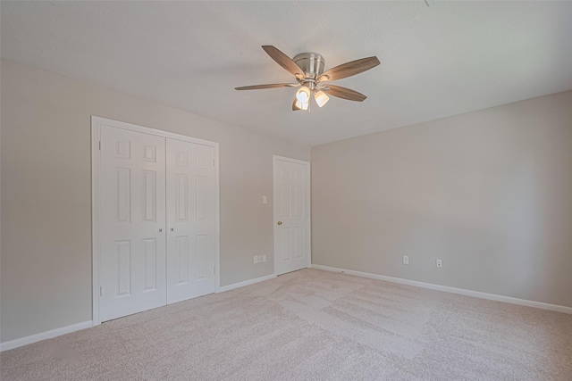 7419 Foxton Place Ct, Houston, TX 77095 - unfurnished bedroom featuring light colored carpet, a closet, and a ceiling fan