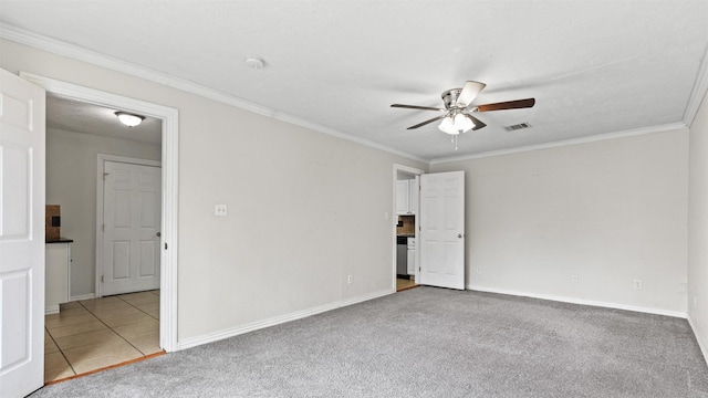 1510 Tarley St, Houston, TX 77009 - unfurnished bedroom featuring ornamental molding, carpet floors, and a ceiling fan