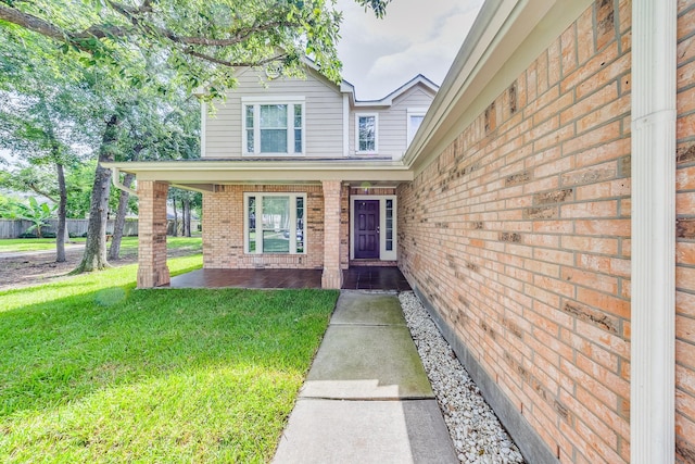 18426 Stark Point Ct, Humble, TX 77346 - entrance to property with brick siding, a lawn, and a porch