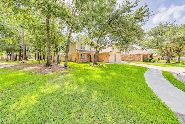 18426 Stark Point Ct, Humble, TX 77346 - view of front of property with brick siding, concrete driveway, and a garage