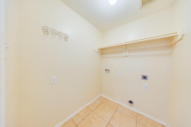 18426 Stark Point Ct, Humble, TX 77346 - laundry room featuring electric dryer hookup, washer hookup, and light tile patterned flooring