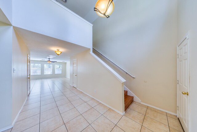 18426 Stark Point Ct, Humble, TX 77346 - staircase featuring tile patterned floors and a ceiling fan