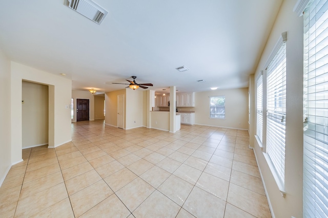 18426 Stark Point Ct, Humble, TX 77346 - unfurnished living room featuring light tile patterned flooring and ceiling fan