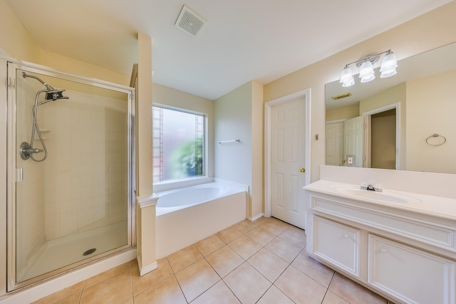 18426 Stark Point Ct, Humble, TX 77346 - full bath with a shower stall, a bath, tile patterned flooring, and vanity