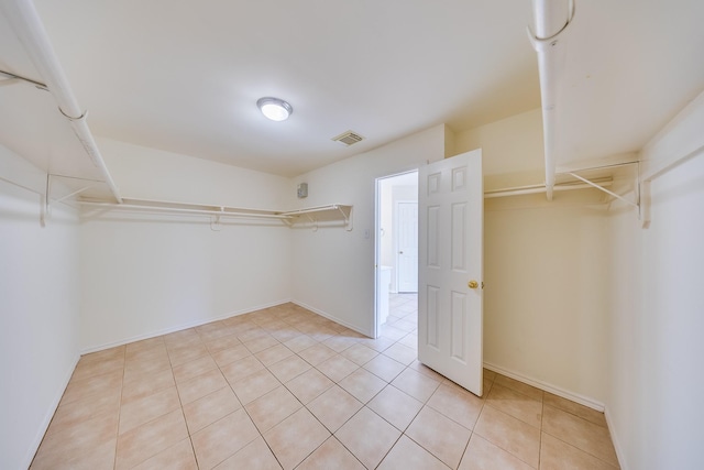 18426 Stark Point Ct, Humble, TX 77346 - walk in closet featuring light tile patterned floors