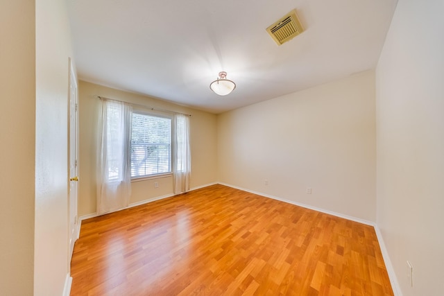 18426 Stark Point Ct, Humble, TX 77346 - spare room featuring light wood-type flooring and baseboards