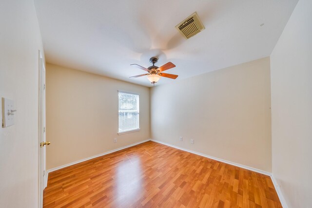 18426 Stark Point Ct, Humble, TX 77346 - unfurnished room featuring a ceiling fan and light wood-style floors