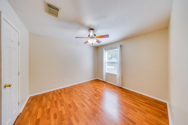 18426 Stark Point Ct, Humble, TX 77346 - empty room featuring light wood finished floors and a ceiling fan