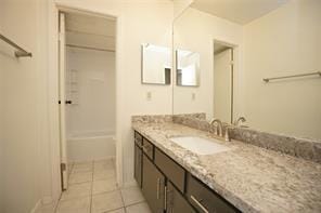 6601 Sands Point Dr Unit 59, Houston, TX 77074 - full bath with vanity, tile patterned floors, and  shower combination