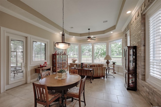 69 W Shore Ln, Montgomery, TX 77356 - dining room with light tile patterned flooring, healthy amount of natural light, a raised ceiling, and crown molding