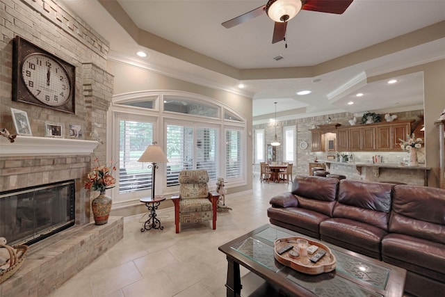 69 W Shore Ln, Montgomery, TX 77356 - living room with a ceiling fan, light tile patterned floors, recessed lighting, a fireplace, and ornamental molding