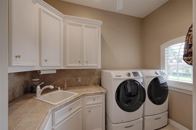 69 W Shore Ln, Montgomery, TX 77356 - laundry room with cabinet space, washing machine and clothes dryer, and a ceiling fan