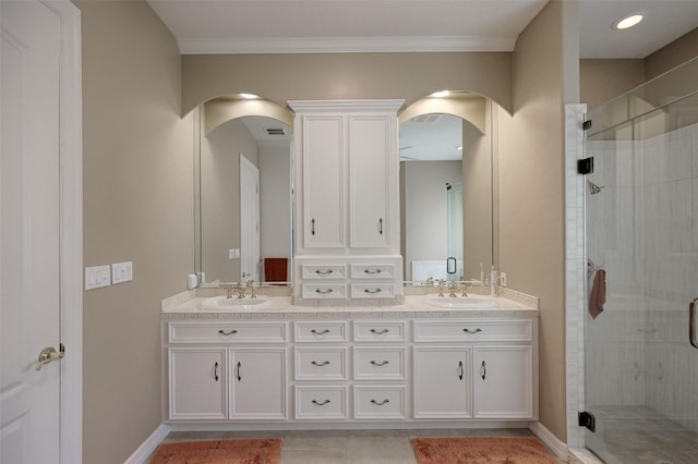 69 W Shore Ln, Montgomery, TX 77356 - bathroom with double vanity, a stall shower, tile patterned flooring, and crown molding
