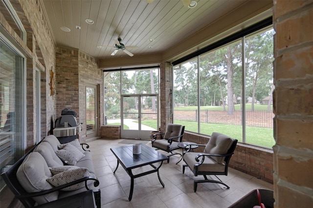 69 W Shore Ln, Montgomery, TX 77356 - sunroom featuring a ceiling fan, outdoor lounge area, and view of wooded area