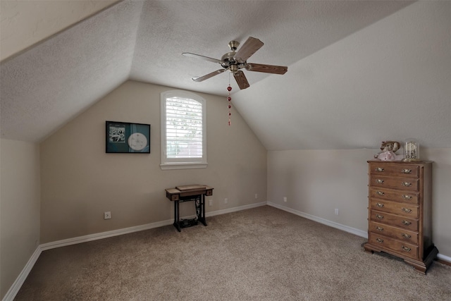 69 W Shore Ln, Montgomery, TX 77356 - additional living space featuring ceiling fan, a textured ceiling, lofted ceiling, and carpet floors