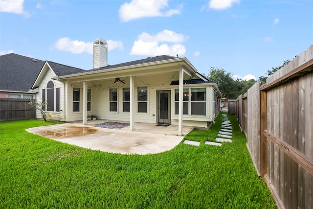 13315 Lake Passage Ln, Houston, TX 77044 - rear view of house featuring ceiling fan, a patio, a chimney, and a fenced backyard