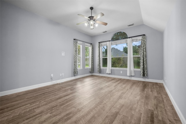 13315 Lake Passage Ln, Houston, TX 77044 - spare room featuring wood finished floors, a ceiling fan, and lofted ceiling