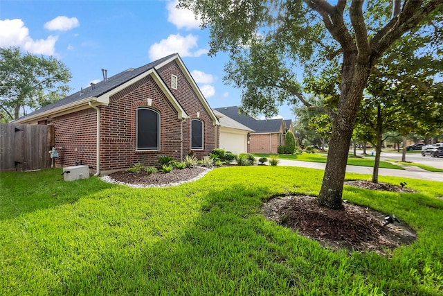13315 Lake Passage Ln, Houston, TX 77044 - view of front of property with brick siding, a garage, and driveway