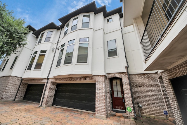 5617 Kiam St Unit A, Houston, TX 77007 - view of front of home featuring brick siding and an attached garage
