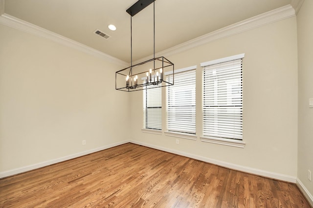 5617 Kiam St Unit A, Houston, TX 77007 - spare room with crown molding, a chandelier, light wood finished floors, and recessed lighting
