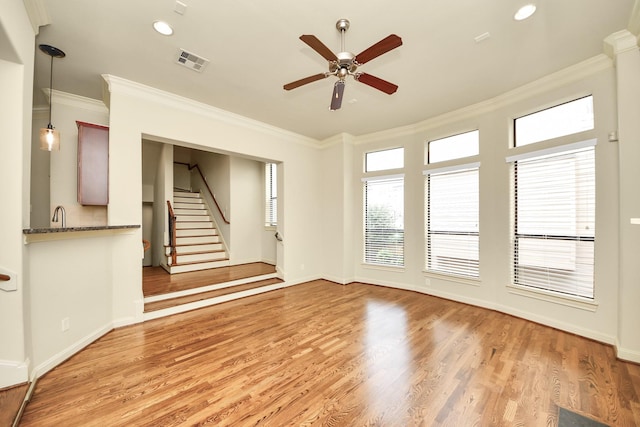 5617 Kiam St Unit A, Houston, TX 77007 - unfurnished living room with crown molding, ceiling fan, light wood finished floors, stairs, and recessed lighting