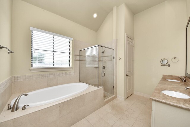 5617 Kiam St Unit A, Houston, TX 77007 - bathroom featuring a bath, a stall shower, double vanity, tile patterned flooring, and lofted ceiling