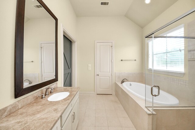 5617 Kiam St Unit A, Houston, TX 77007 - bathroom featuring vanity, a garden tub, tile patterned floors, and vaulted ceiling