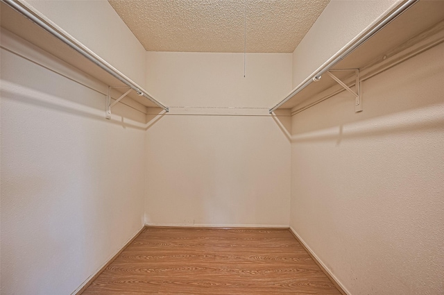 5615 Briarwood Forest Dr, Houston, TX 77088 - walk in closet with wood finished floors