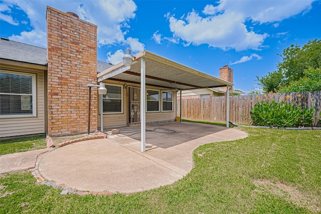 5615 Briarwood Forest Dr, Houston, TX 77088 - rear view of house with a chimney and a patio