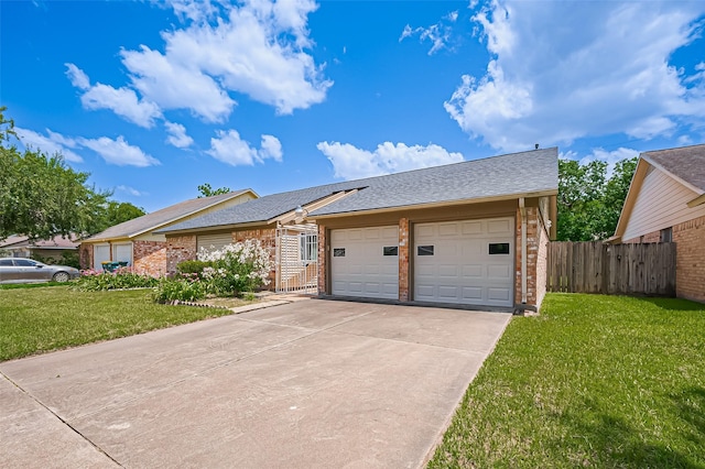 5615 Briarwood Forest Dr, Houston, TX 77088 - view of front of home with brick siding, a garage, concrete driveway, solar panels, and roof with shingles